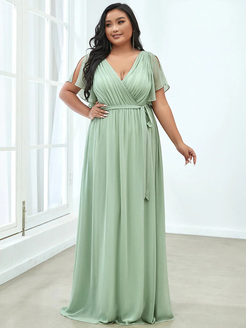 Mint green plus sized bridesmaid dress with v-neck and a-line.
